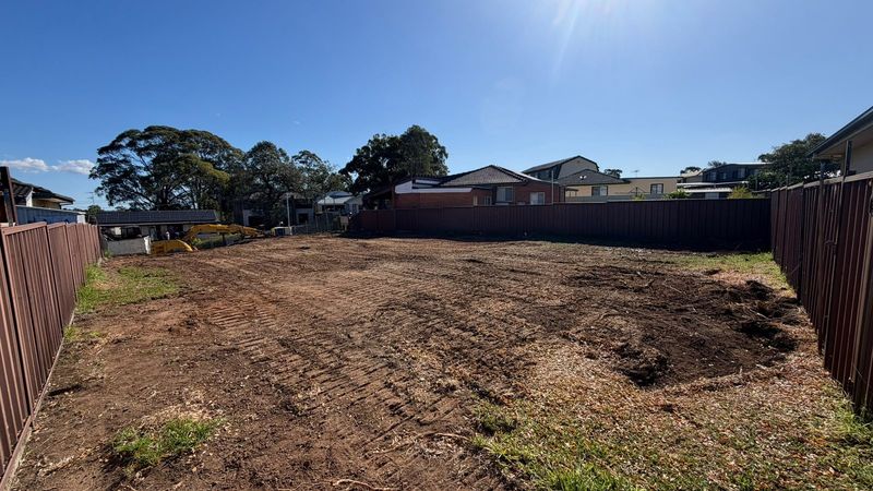 Cleared and levelled residential block in Sydney, fenced and prepared for construction