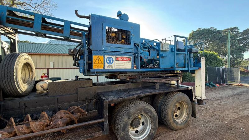 Truck-mounted piling rig on site during basement underpinning and foundation work